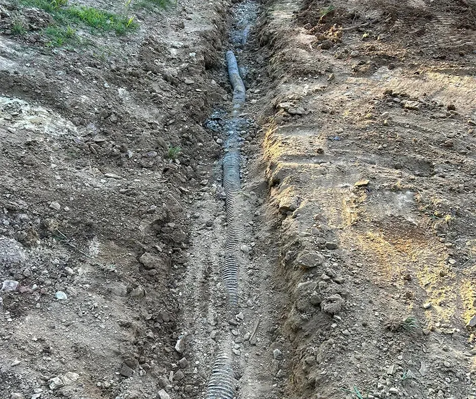 Downspout Connection During French Drain Installation in Westchester, NY Downspout Connection During French Drain Installation in Westchester, NY