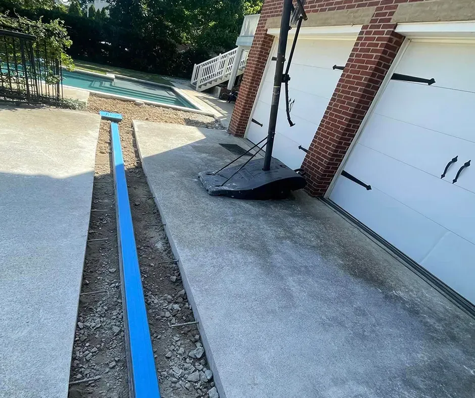 Pipe Placement in Progress for French Drain Installation in Westchester, NY Pipe Placement in Progress for French Drain Installation in Westchester, NY